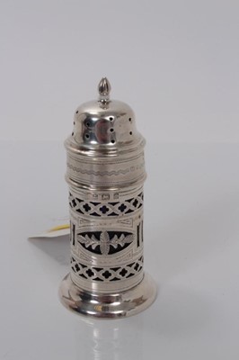 Lot 10 - Edwardian silver sugar caster of lighthouse form, with pierced decoration and blue glass liner, (Birmingham 1905), marker Alexander Clark, 10.5cm high, (1.5oz)