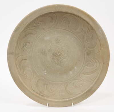 Lot 103 - Chinese celadon dish, Yuan dynasty, from the Java shipwreck, with incised floral decoration, 32cm diameter