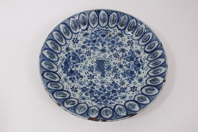 Lot 179 - An 18th century Dutch Delft dish, with unusual leaf moulded border