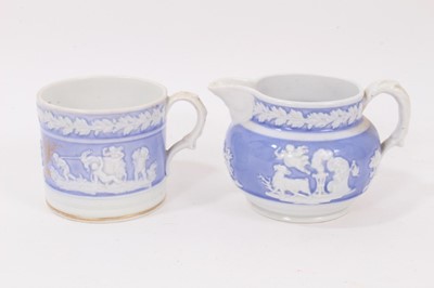 Lot 172 - A New Hall mug, with applied decoration, on a lilac ground, and dated 1819, and a similar jug