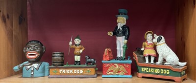 Lot 138 - Four 19th century American style cast iron money boxes