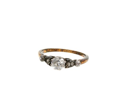 Lot 488 - Diamond single stone ring with an old cut diamond weighing 
approximately 0.40cts in platinum claw setting with rose cut 
diamonds to the shoulders on 18ct yellow gold shank