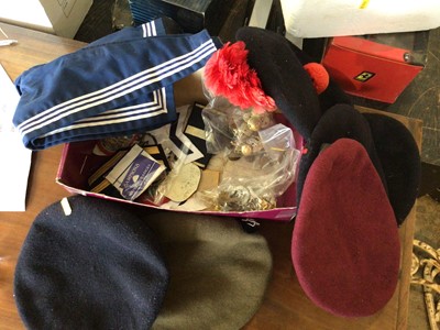 Lot 244 - Box of military badges and berets with cap badges