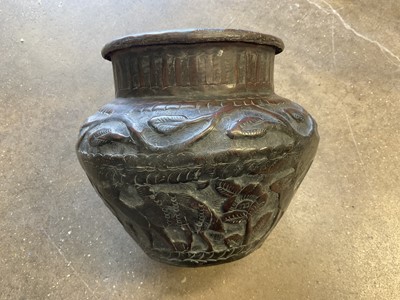 Lot 167 - 19th century brass vase of baluster form, probably Indian, decorated in relief with animals and foliate patterns