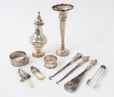 Lot 540 - George V silver sugar caster, (London 1911), together with a silver spill vase, silver and mother of pearl babies rattle and other silver items, (various dates and makers), 5ozs of weighable silver.
