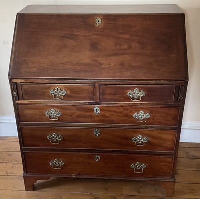 Lot 1383 - George III mahogany bureau.
