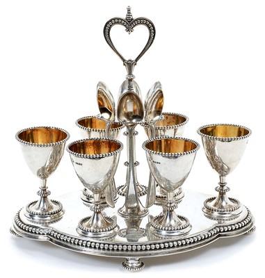 Lot 317 - Victorian silver egg frame of shaped oval form, with beaded border, engraved crest and monogram