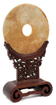 Lot 708 - Antique Chinese jade bi-disc on carved wood stand