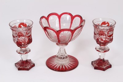 Lot 127 - Good pair of Bohemian flash cut ruby glass goblets, decorated with stags, hounds and horses, together with a similar pedestal bowl