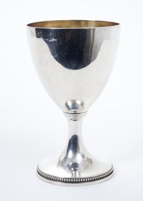 Lot 232 - George III silver goblet / chalice of conventional form with gilded interior and raised on circular pedestal foot with beaded border, (London 1775), maker I.C. all at 8.5ozs, 15.5cm in overall height.