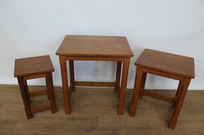 Lot 1327 - Nest of three Robert 'Mouseman' Thompson adzed oak tables