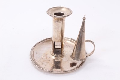 Lot 414 - George III silver chamberstick of oval form with beaded borders, removable snuffer and sconce, and engraved armorials, (London 1786), maker Thomas Chawner, all at 8ozs, 16cm in diameter.