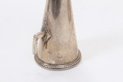 Lot 414 - George III silver chamberstick of oval form with beaded borders, removable snuffer and sconce, and engraved armorials, (London 1786), maker Thomas Chawner, all at 8ozs, 16cm in diameter.