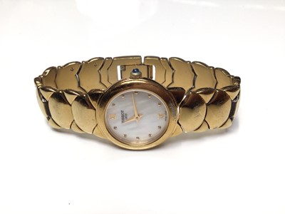 Lot 39 - Ladies Tissot gold plated wristwatch, with papers and extra links, together with a Beltime digital watch and a Trafalgar digital watch (3)
