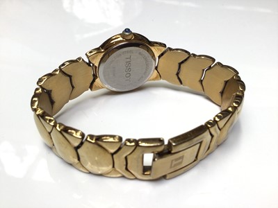 Lot 39 - Ladies Tissot gold plated wristwatch, with papers and extra links, together with a Beltime digital watch and a Trafalgar digital watch (3)