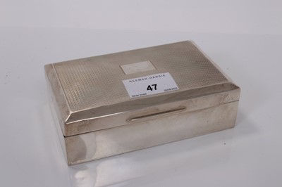 Lot 47 - George V silver cigarette box of rectangular form with engine turned decoration to lid with vacant central cartouche and cedar lined interior, (Birmingham 1927), makers mark rubbed, 13.8cm in lengt...