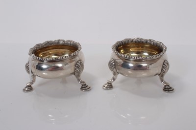Lot 61 - Pair of Victorian silver salts of cauldron form with engraved armorials, gilded interiors and raised on three hoof feet, (London 1841), maker W. M., 6.5cm in diameter , all at 6ozs (2)
