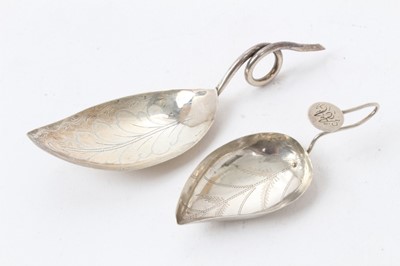 Lot 543 - George III silver leaf-shaped bowl caddy spoon with bright cut decoration and wire loop handle , marks incomplete, maker Cocks and Bettridge, 7cm