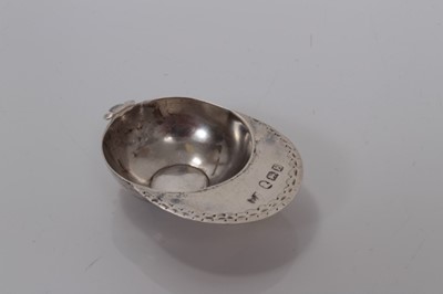 Lot 83 - George III silver jockey cap caddy spoon with bright cut decoration, London 1800, Elizabeth Morley, 5cm