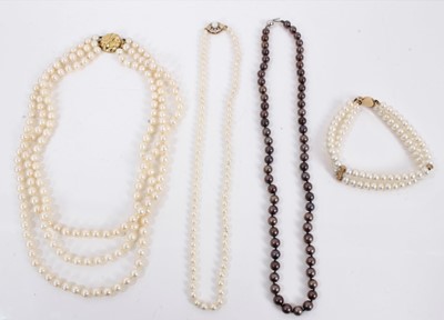 Lot 419 - Cultured pearl three strand necklace, a cultured pearl single stand necklace, black cultured pearl necklace and a cultured pearl bracelet