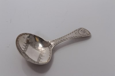 Lot 90 - George III silver oval bowl caddy spoon with bright cut decoration, London 1800, Thomas Streetin 7.5 cm