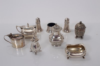 Lot 140 - Elizabeth II silver three piece cruet set comprising salt, salt cellar and pepperette, (Birmingham 1963 / 1964) together with three silver mustard pots, two silver pepperettes and a silver salt cel...