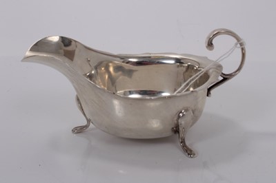 Lot 161 - George V silver sauce boat of helmet form, (Sheffield 1932), 4oz, 14.5cm in length.