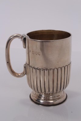 Lot 164 - Victorian silver christening mug with fluted decoration, (London 1895), maker William Hutton & Sons Ltd, 2ozs, 9cm in overall height.
