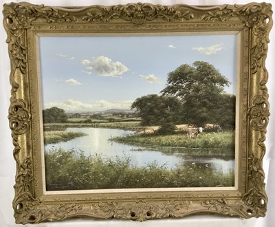 Lot 128 - David Morgan (Born 1947) - oil on canvas in gilt frame - Cows grazing in meadow by river