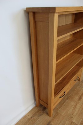 Lot 17 - Contemporary light oak open bookcase with adjustable shelves and two drawers below, 95cm wide, 28.5cm deep, 120cm high