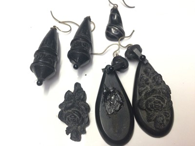 Lot 23 - Victorian coral and seed pearl horseshoe shaped brooch, two antique mourning lockets with enamel decoration and a small selection of jet earrings