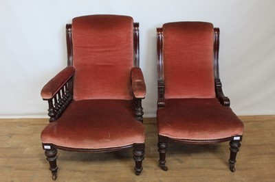 Lot 1323 - Victorian mahogany framed gentlemen's chair with pink upholstery, together with a matching ladies chair (2)