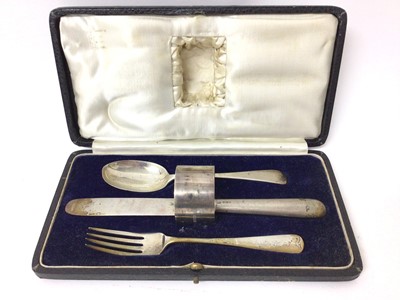 Lot 191 - Silver knife, fork, spoon and napkin ring set in fitted case