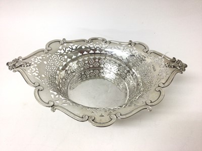 Lot 230 - Edwardian silver pierced bowl with moulded mask handles on four scrolled feet