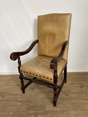 Lot 1273 - 17th century style stud leather upholstered oak scroll armchair