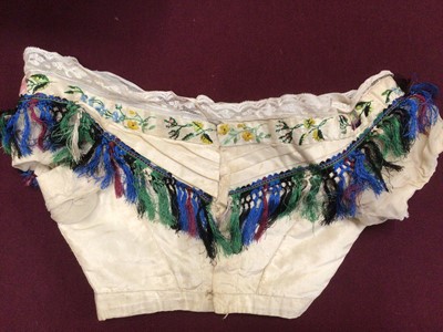 Lot 2112 - Victorian silk bodice and skirt. Hand-embroidered flowers, exotic birds and insects, trimmed with a tasselled braiding.
