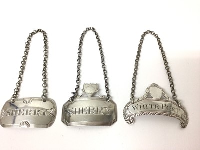 Lot 183 - Three Georgian silver wine labels for sherry and white port