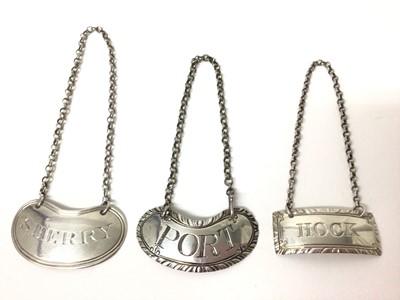 Lot 184 - Three Georgian silver wine labels for sherry, port and hock (3)