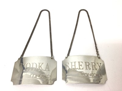 Lot 185 - Pair modern silver Concorde wine labels for vodka and sherry (2)
