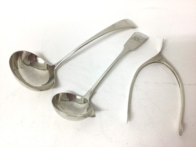 Lot 204 - William IV silver sauce ladle (Dublin 1831), another Georgian silver ladle and pair novelty silver wishbone. Sugar nips (Birmingham 1928) (3)