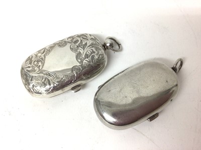 Lot 215 - Two George V silver double sovereign holders, one with floral engraved decoration (Birmingham 1912 & 1913) both 5cm long