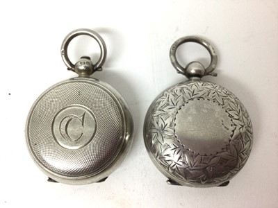 Lot 221 - Two silver sovereign cases, one floral engraved, the other engine turned (2)
