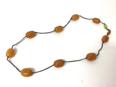 Lot 233 - Old butterscotch Amber bead necklace