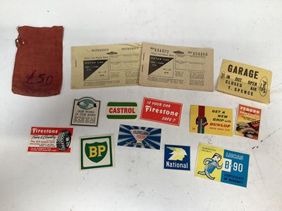 Lot 2013 - Two Second World War fuel ration books, together with a group of original 1950's / 60's fuel and tyre advertising stickers