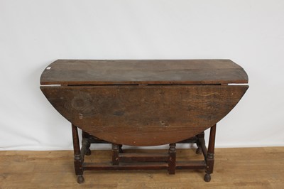 Lot 1329 - 18th century country oak drop-flap gateleg table on turned supports, 122cm wide