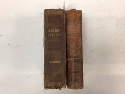 Lot 1698 - Charles Dickens - Pickwick Papers, half calf binding, together with Dombey & Son, both early editions in book form, cloth binding. (2)