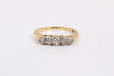 Lot 245 - Ladies gold 18ct diamond five stone ring