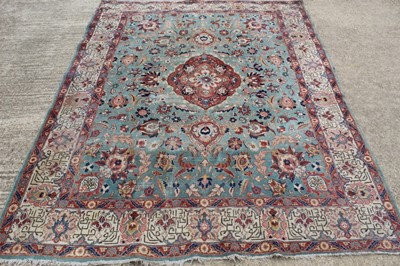 Lot 1429 - Large Turkish design rug on turquoise ground