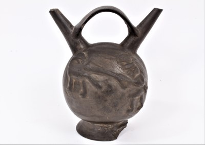 Lot 360 - Ancient pre-Columbian pottery vessel with loop handle and 
twin spouts, moulded figures with clubs hunting big cats.