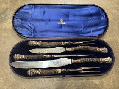 Lot 142 - Large Victorian antler handled carving set, two further cased sets